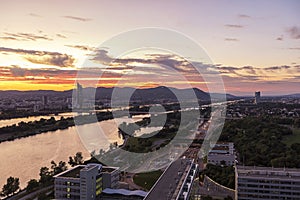 Dusk at the Danube River with the public recreation area called Danube Island and Kahlenberg