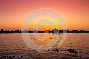 dusk dawn river view sunset orange sky. evening silhouette boat quiet calm chaophraya riverside landscape