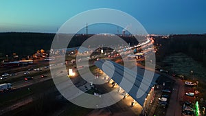 Dusk Descends on Bustling Highway Overpass: An Aerial View