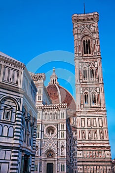 Dusk falls over the Baptistery of St. John, Giotto Campanile and Florence Cathedral consecrated in 1436