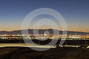 Dusk high angle view of the skyline of Las Vegas with Excavator below