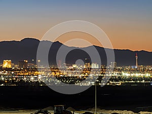 Dusk high angle view of the skyline of Las Vegas with Excavator below