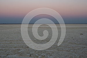 Dusk in Makgadikgadi Salt Pan - Empty Flat Plain and Horizon photo