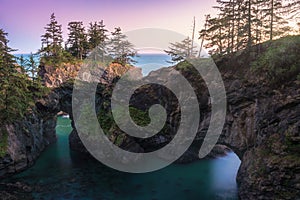 Dusk at Natural Bridges along Samuel H. Boardman State Scenic Corridor, Oregon during a golden hour sunset. USA photo