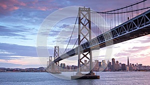 Dusk over San Francisco-Oakland Bay Bridge and San Francisco Skyline, California, USA.