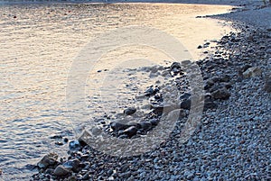 Dusk Reflections on Rocky Beach, Greece