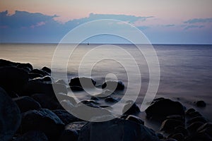 Dusk at a rockey sea shore