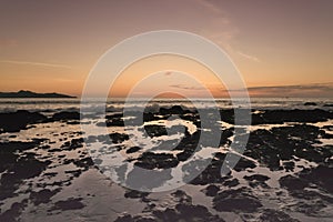 Dusk on a rocky ocean beach