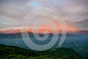 At dusk, the romantic red or orange sunset glow on the top of the mountain.