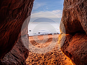 Dusk\'s Serenade: Sunset Spectacle from Veczemju Klintis Cave