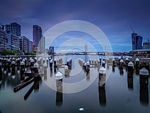 Dusk sets in at Melbourne Docklands with Pilons in the Foreground photo