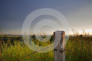 Dusk suburban barbed wire