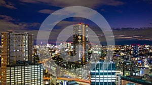 A dusk time lapse of cityscape in Tokyo high angle wide shot