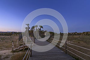 Dusk view in walkway to Salgados beach in Albufeira, Algarve.