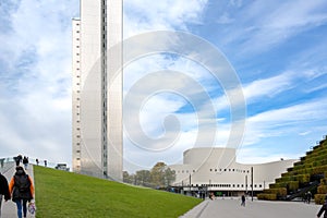 Dusseldorf - urban redevelopment.  Diagonally rising walkable green roof, three-slice high-rise, Schauspielhaus, green walls