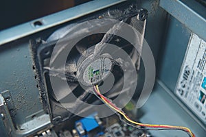 Dust on computer pc processor cooler with mainboard and computer case fragment