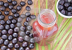 Dust, fruit and juice of acai Euterpe oleracea