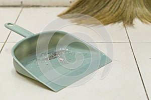 Dust in the gray plastic dustpan