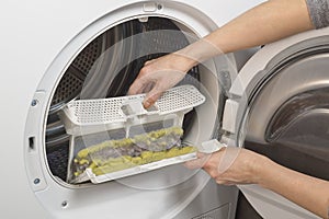 Dust and hairs in reservoir , fluffy trap of the drying machine