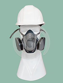 Dust mask and helmet on mannequin.