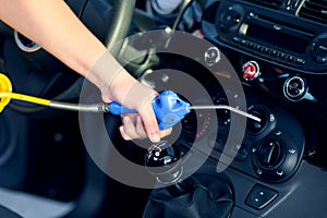 Dust removal with air gun at car wash