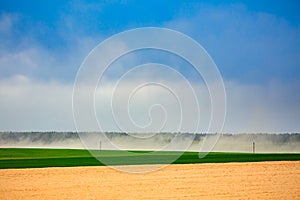 Dust storm in dry fields, dry weather infuenced by climate change