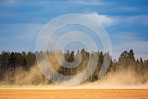 Dust storm in dry fields, dry weather infuenced by climate change