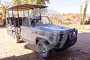 Dusternbrook Safari Guest FarmÂ open air vehicle parked awaiting tourists for game drive