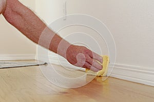 Dusting a Baseboard