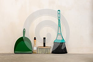 dustpan brush and metal for cleaning the room against the wall