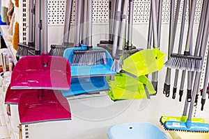 dustpans and brooms for cleaning rooms and offices on the counter