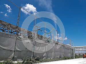 Dustproof walls tearing against the blue sky