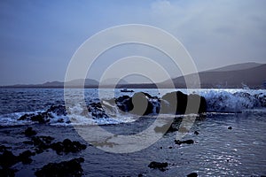 Dusty beach scene in front of Arrieta, Lanzarote photo