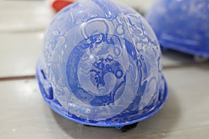 Dusty blue protective building helmet on table