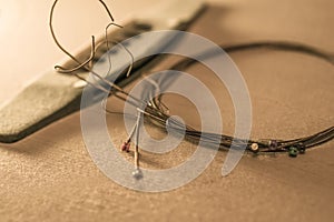 Dusty Classical Guitar and removed strings. Close-up with selective focus