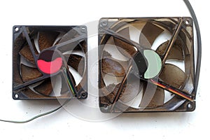 Dusty computer fans on a white