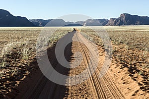 Dusty desert road to nowhere. Southern Namibia.