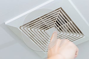 Dusty dirty ceiling air ventilation fan hole grill duct