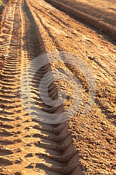 Dusty gravel road with imprint