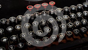 Dusty old typewriter keyboard with round keys