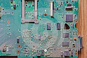 Dusty printed circuit board. Logic board covered with dust, close-up.