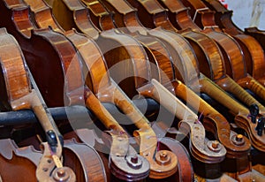 Dusty violins in rack