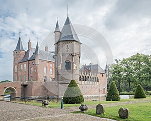 Dutch 18th century castle with garden and cloudy sky