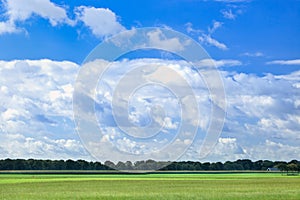 Dutch agrarian landscape with dramatic shaped clouds