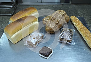 Dutch bakery products placed on a tray: bread, rolls, muffins