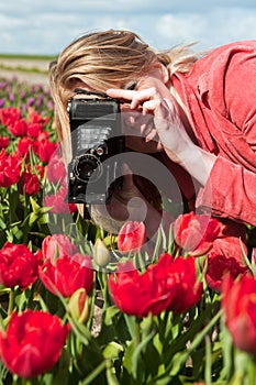 Dutch blond girl with old photo camera