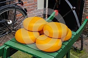 Dutch cheese on traditional wooden barrow in Amsterdam, Netherlands