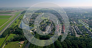 Dutch City Franeker, Neighbourhood Next to A31 Highway, Moving Closer - Friesland, The Netherlands, 4K Drone Footage