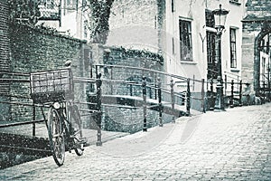 The Dutch city of Gouda with a bicycle in front in winter photo