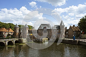 Dutch city during summer, Medieval town wall Koppelpoort and the Eem river in Amersfoort, Netherlands